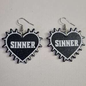 "SINNER" black glitter spiked heart-shaped acrylic earrings, goth punk aesthetic